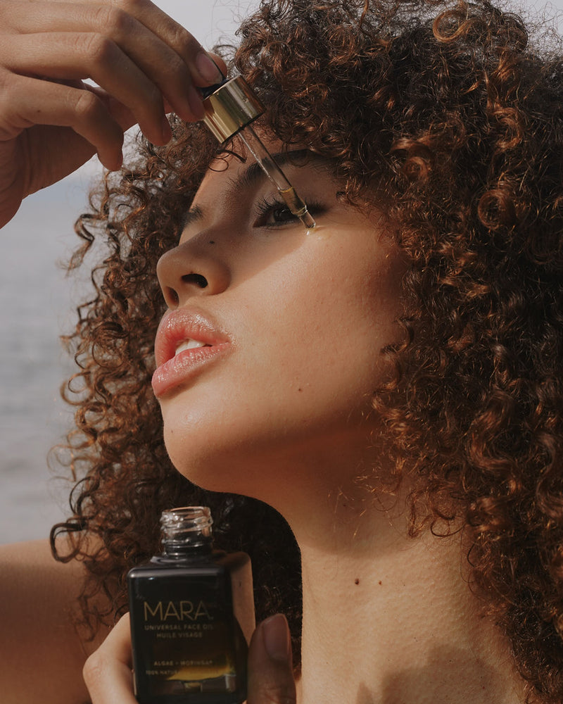 Model using Universal Face Oil | MARA Beauty