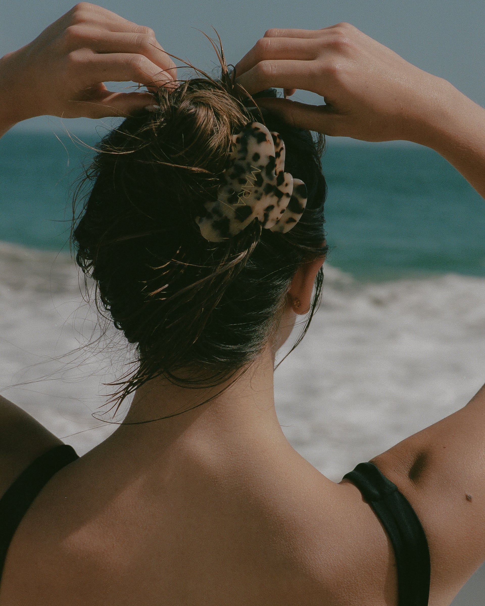Model with hair in bun with MARA hair claw