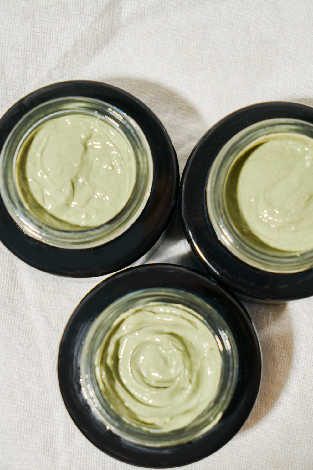 MARA Volcanic Sea Clay Detox Masque jars open with green product