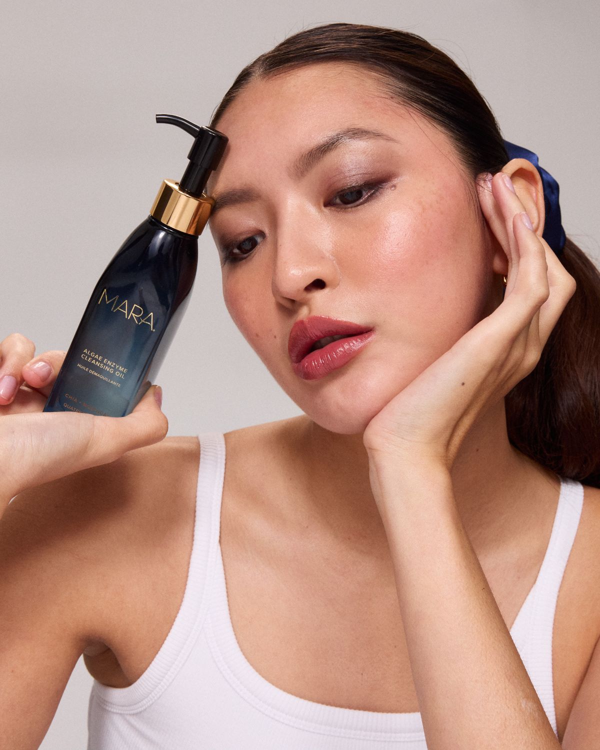 Model holding aeco in hand 