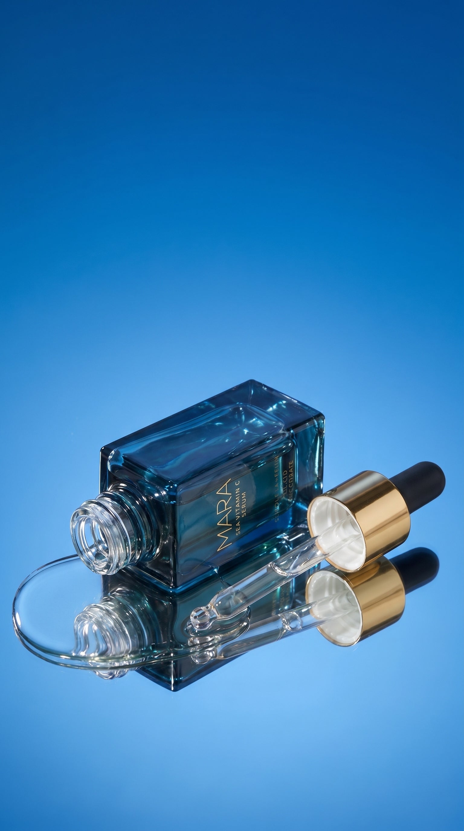 MARA Sea Vitamin C Serum bottle in a puddle of its face oil