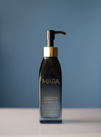 Black bottle with pump and gold cap labeled 'MARA' on a blue background