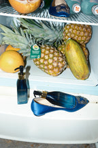 algae enzme cleansing oil in refrigerator with fruit