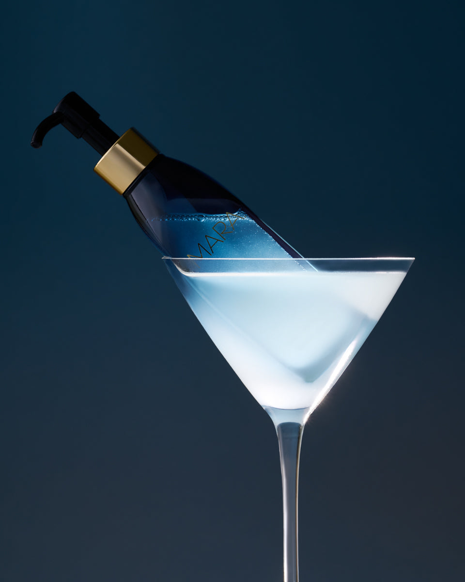 Algae Enzyme Cleansing Oil sitting in a Martini glass