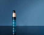 Deluxe+ Algae Enzyme Cleansing Oil on blue background