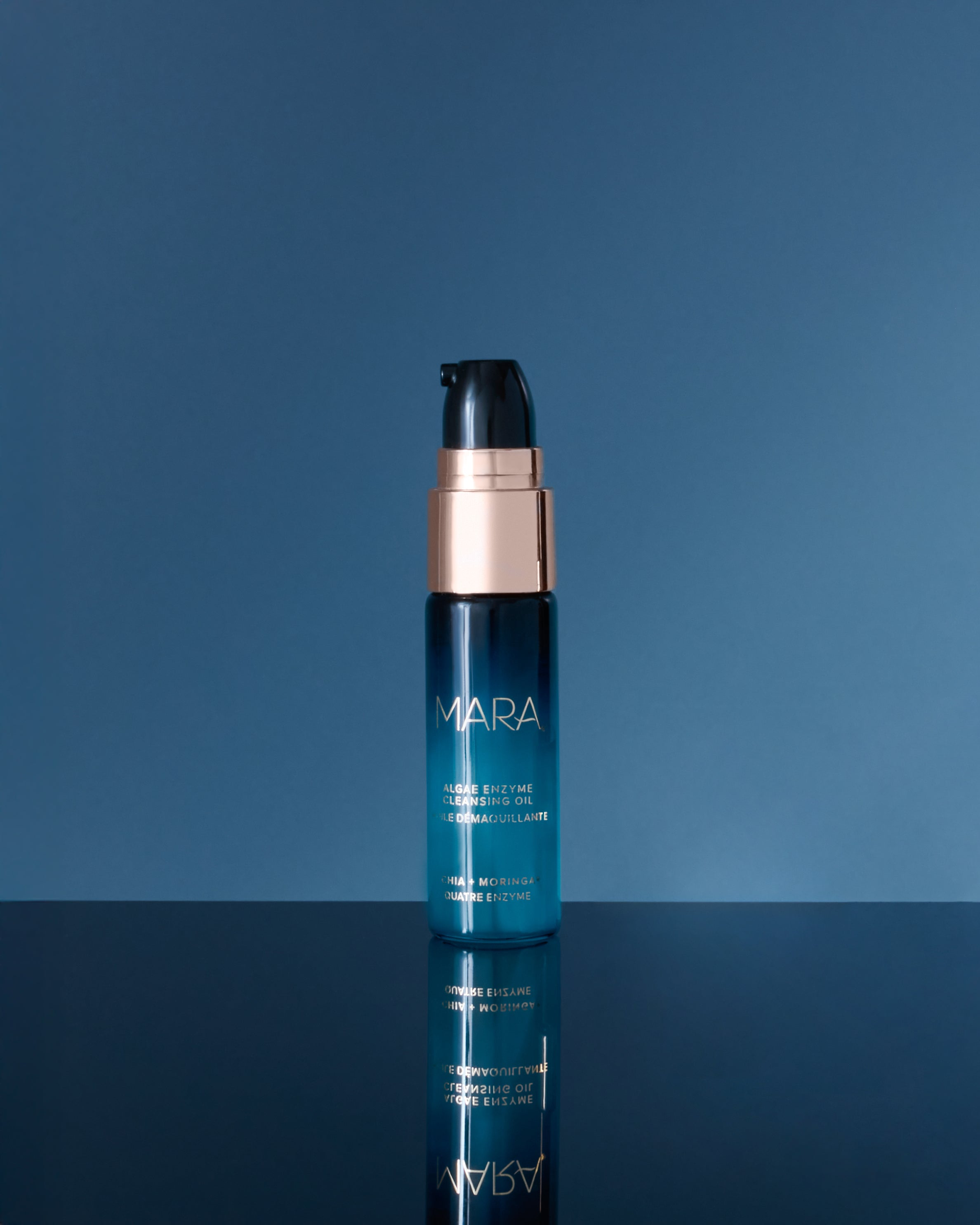 Deluxe+ Algae Enzyme Cleansing Oil on blue background