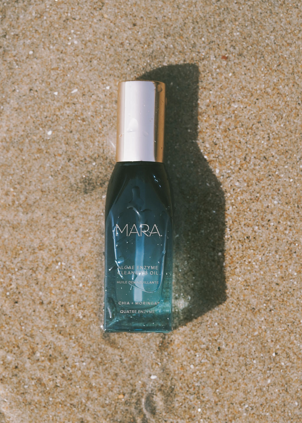 Mini Algae Enzyme Cleansing Oil on sand