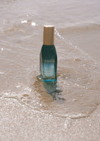 Mini Algae Enzyme Cleansing Oil in the sand