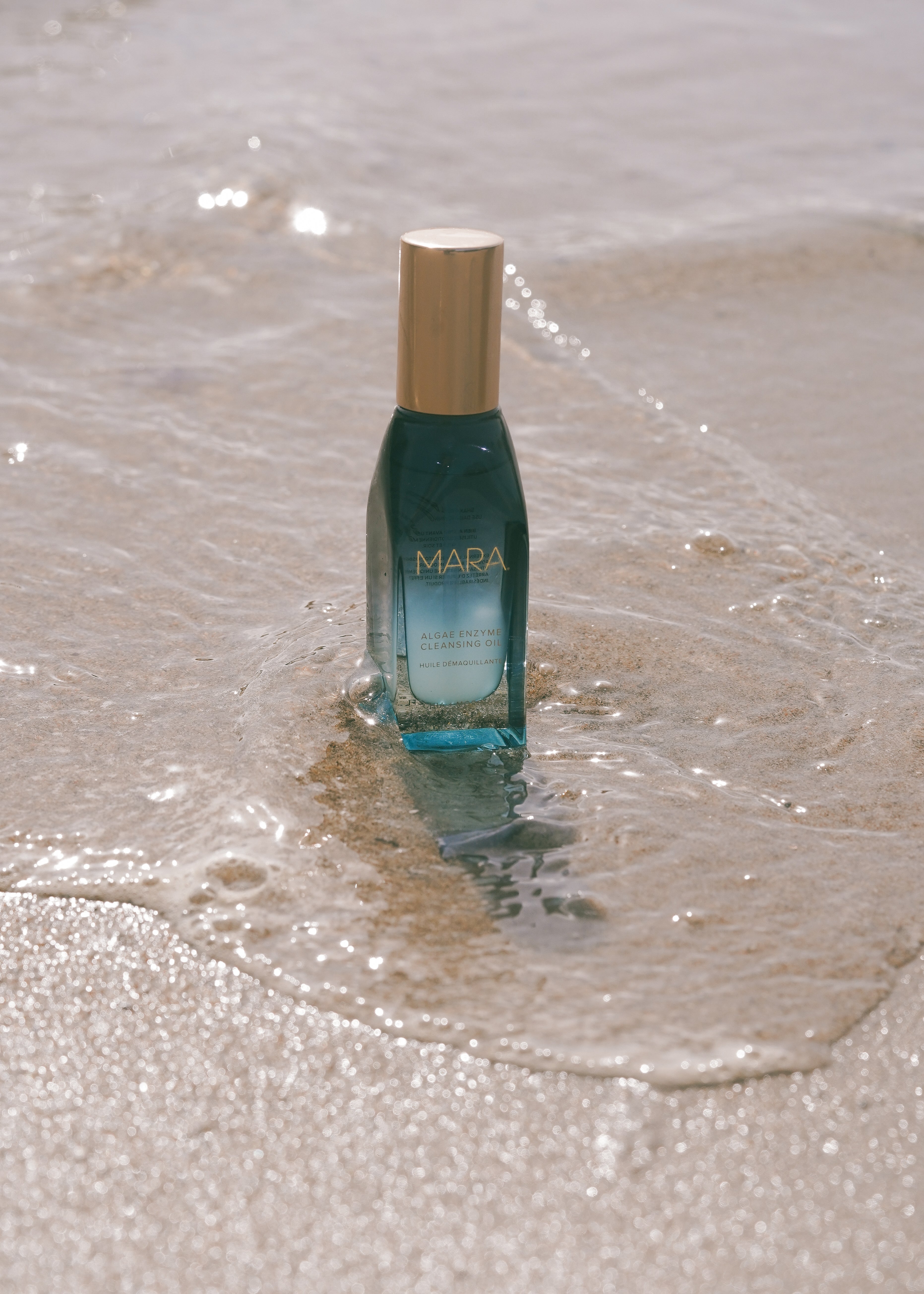 Mini Algae Enzyme Cleansing Oil in the sand