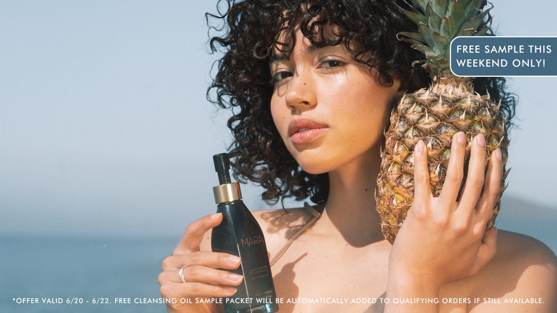 model holding Algae Enzyme Cleansing Oil and pineapple