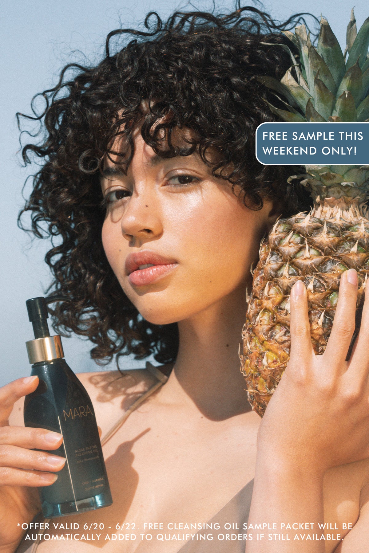 model holding Algae Enzyme Cleansing Oil and pineapple