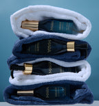 Algae Enzyme Cleansing Oil with mini size and folded in between towels