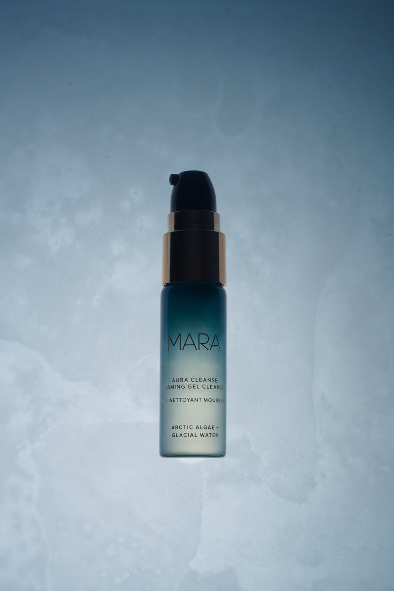 Deluxe+ Aura Cleanse Foaming Gel Cleanser on blue background