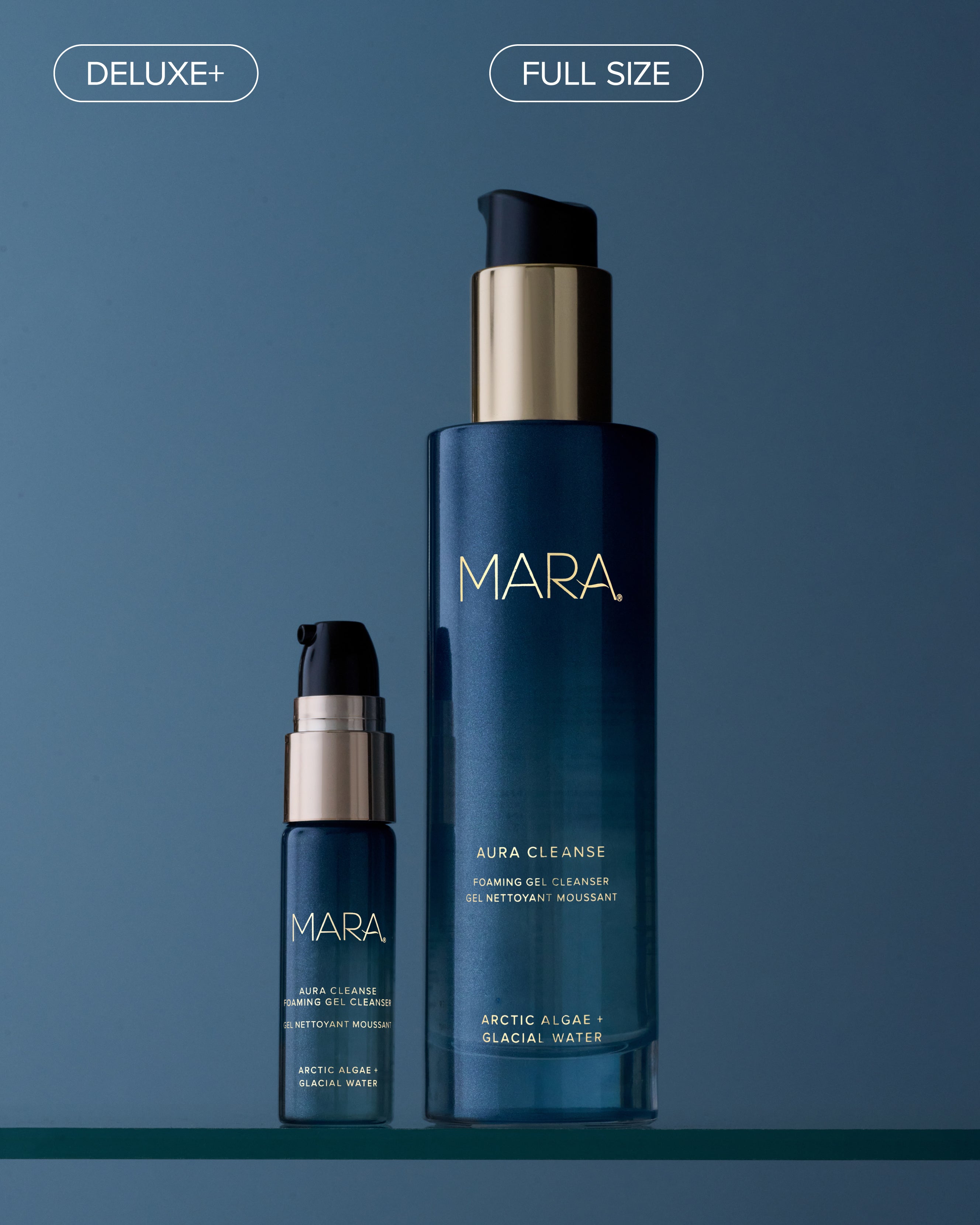 Two sizes of Aura Cleanse Foaming Gel Cleanser on glass shelf with blue background