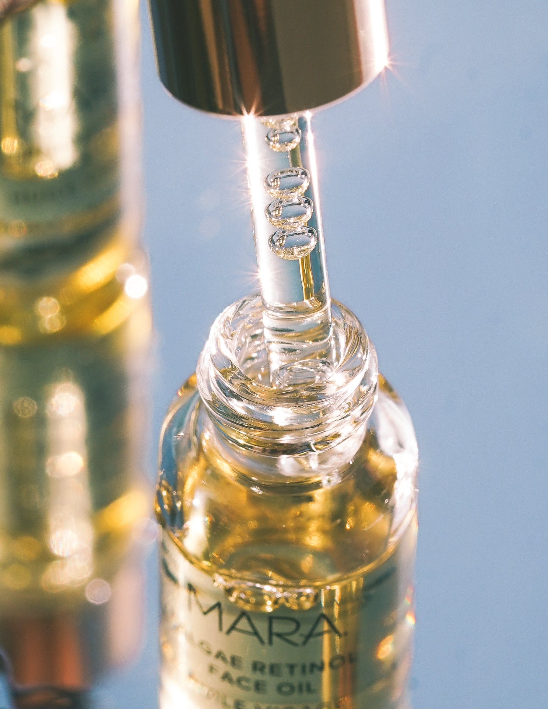 Algae Retinol face Oil deluxe open with dropper