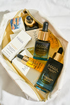 Different sizes of Algae Retinol Face Oil in canvas bag