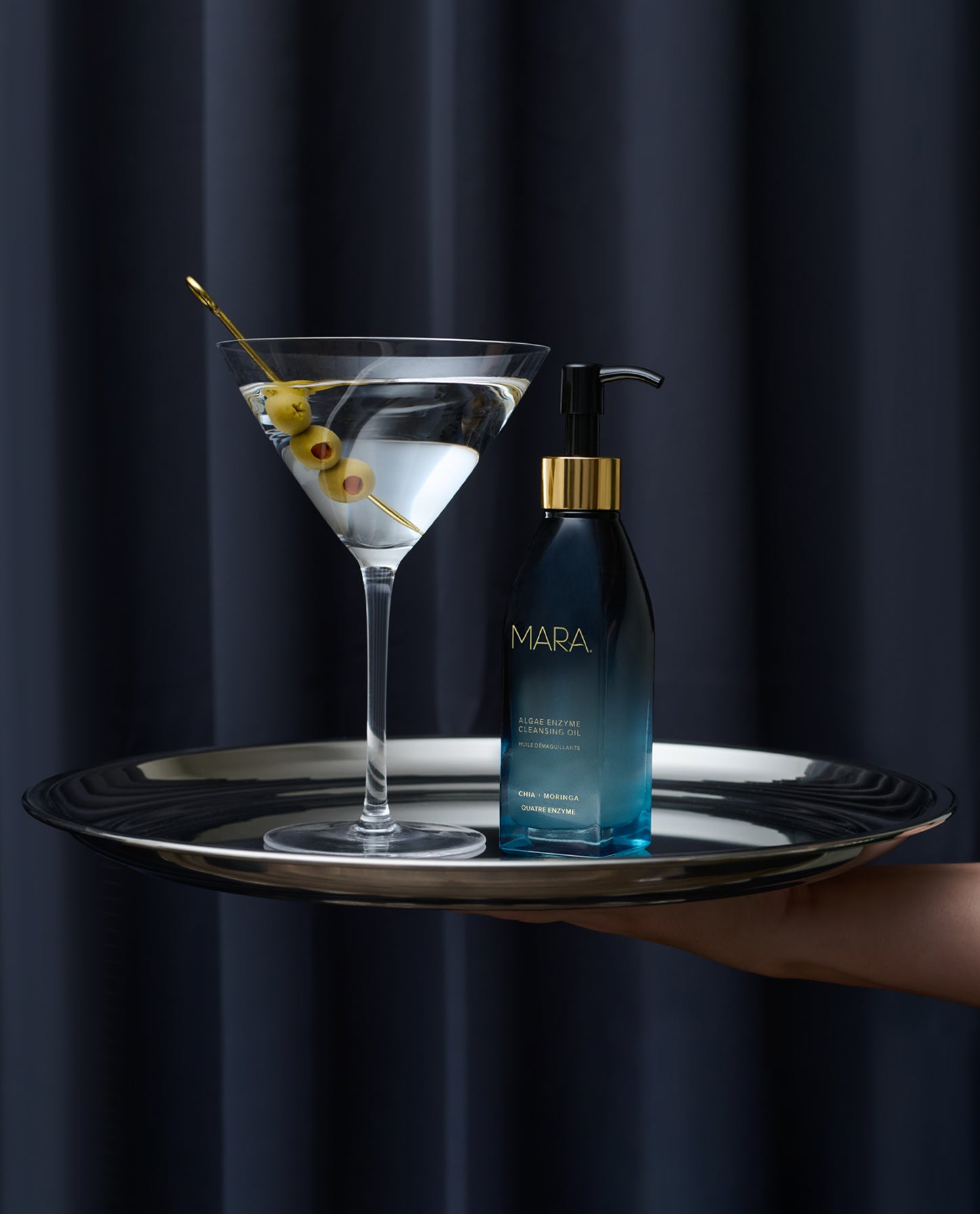 Algae Enzyme Cleansing Oil and martini on serving dish
