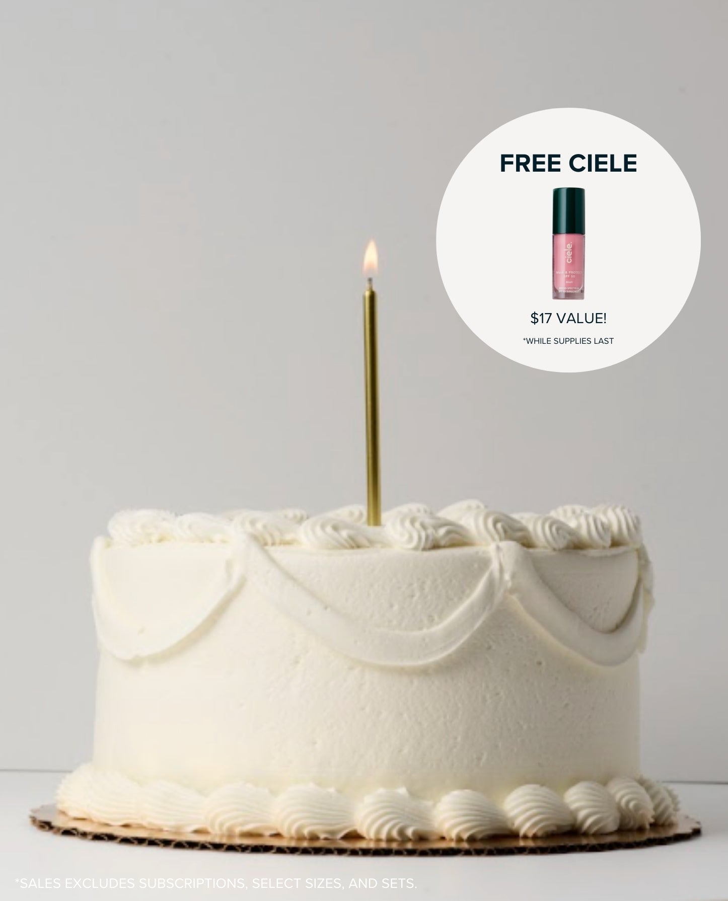 White cake with a lit candle and a lip product offer on a gray background