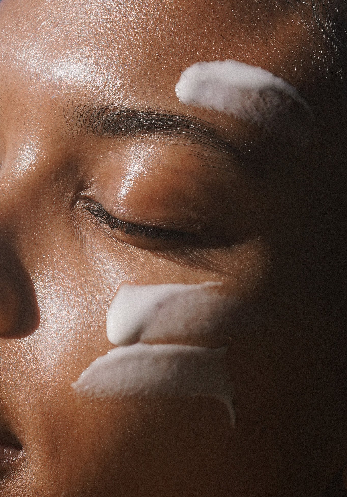 Close up of a person with Clear Skin Mineral Milk on face
