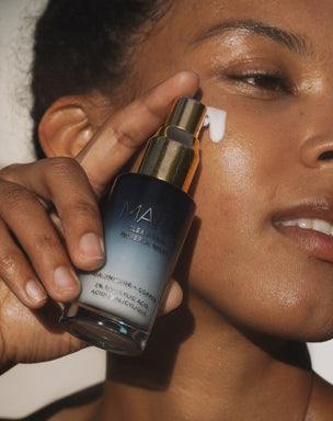 girl applying clear skin mineral milk to skin