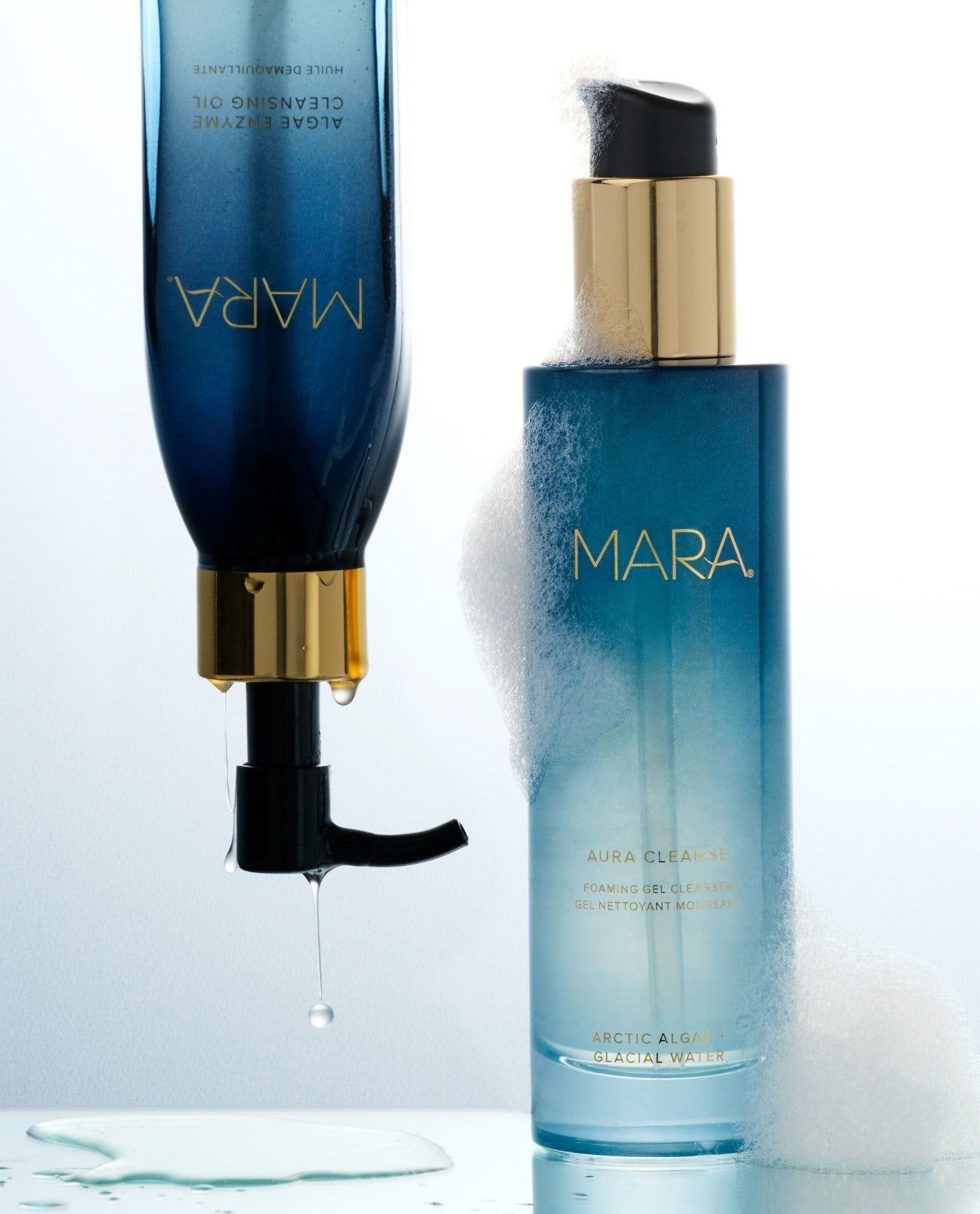 Algae Enzyme Cleansing Oil upside down next to Aura Cleanse Gel Cleanser