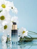 Flower Acid Algae Serum and flowers on blue background