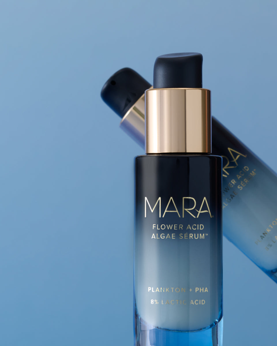 Flower Acid Algae Serum on blue background