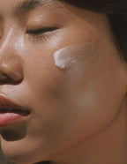 Close-up of a person with Flower Acid Algae Serum on face