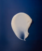 Flower Acid Algae Serum Swatch on dark blue background