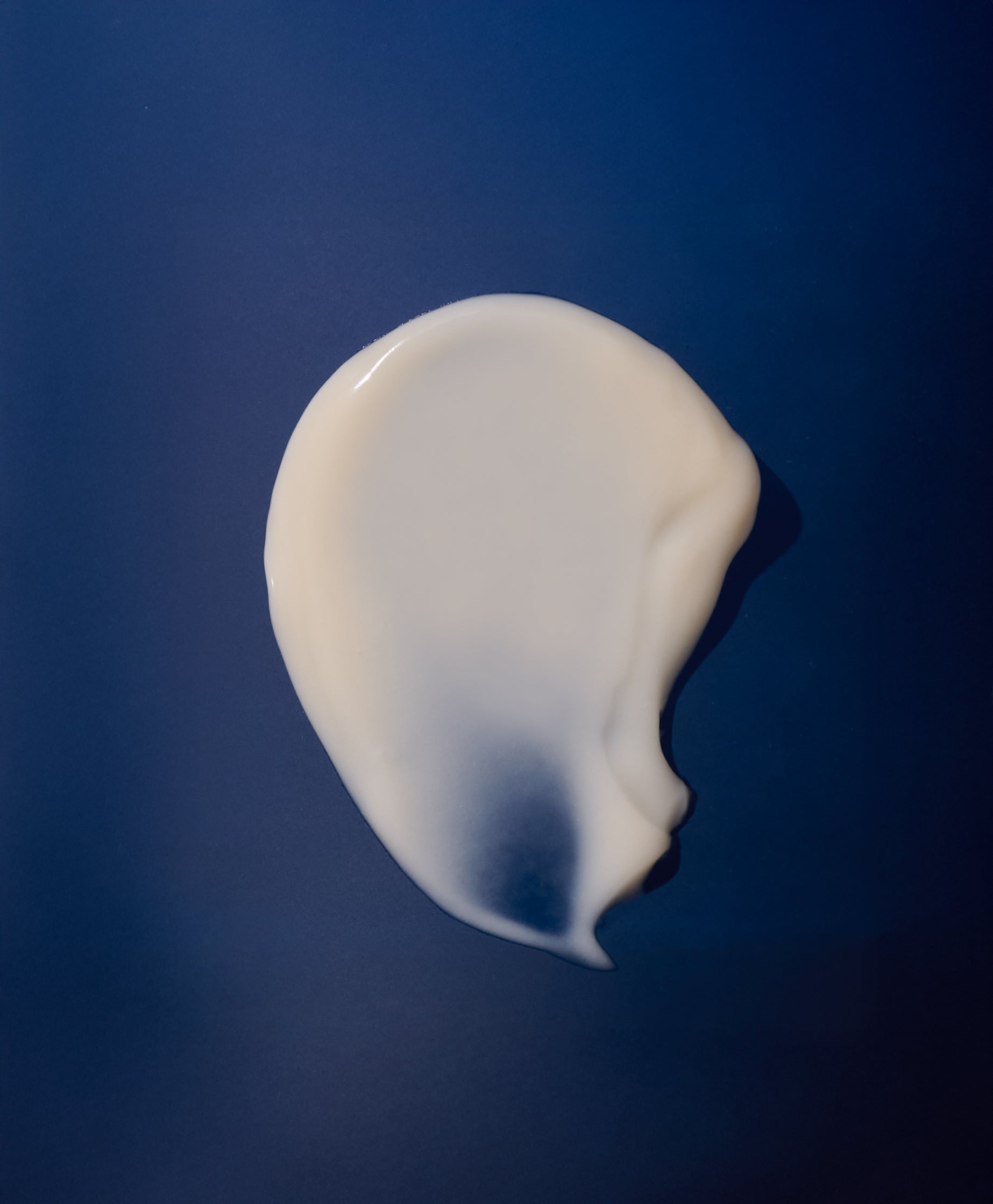 Flower Acid Algae Serum Swatch on dark blue background