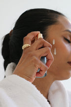 model applying clear skin mineral milk