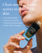 Model holding a algae retinol oil bottle to chin with clean beauty information
