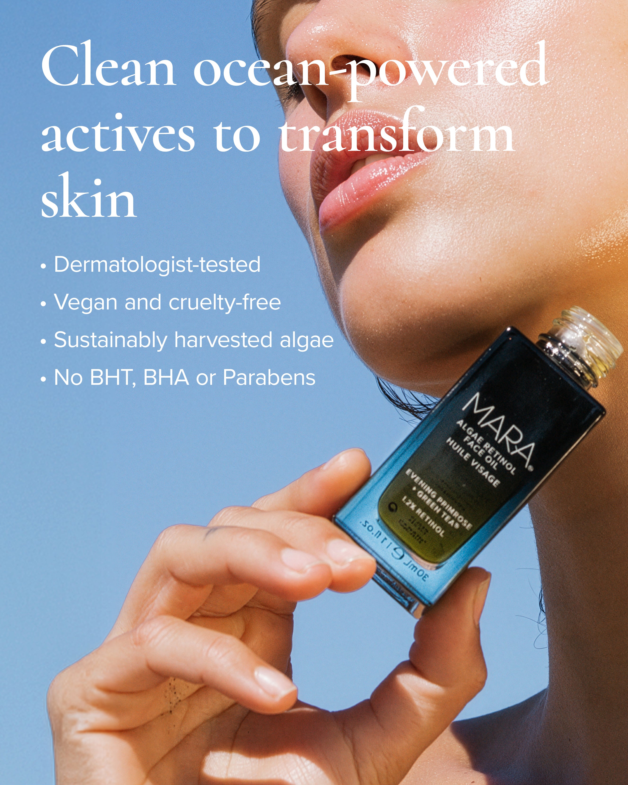 Model holding a algae retinol oil bottle to chin with clean beauty information