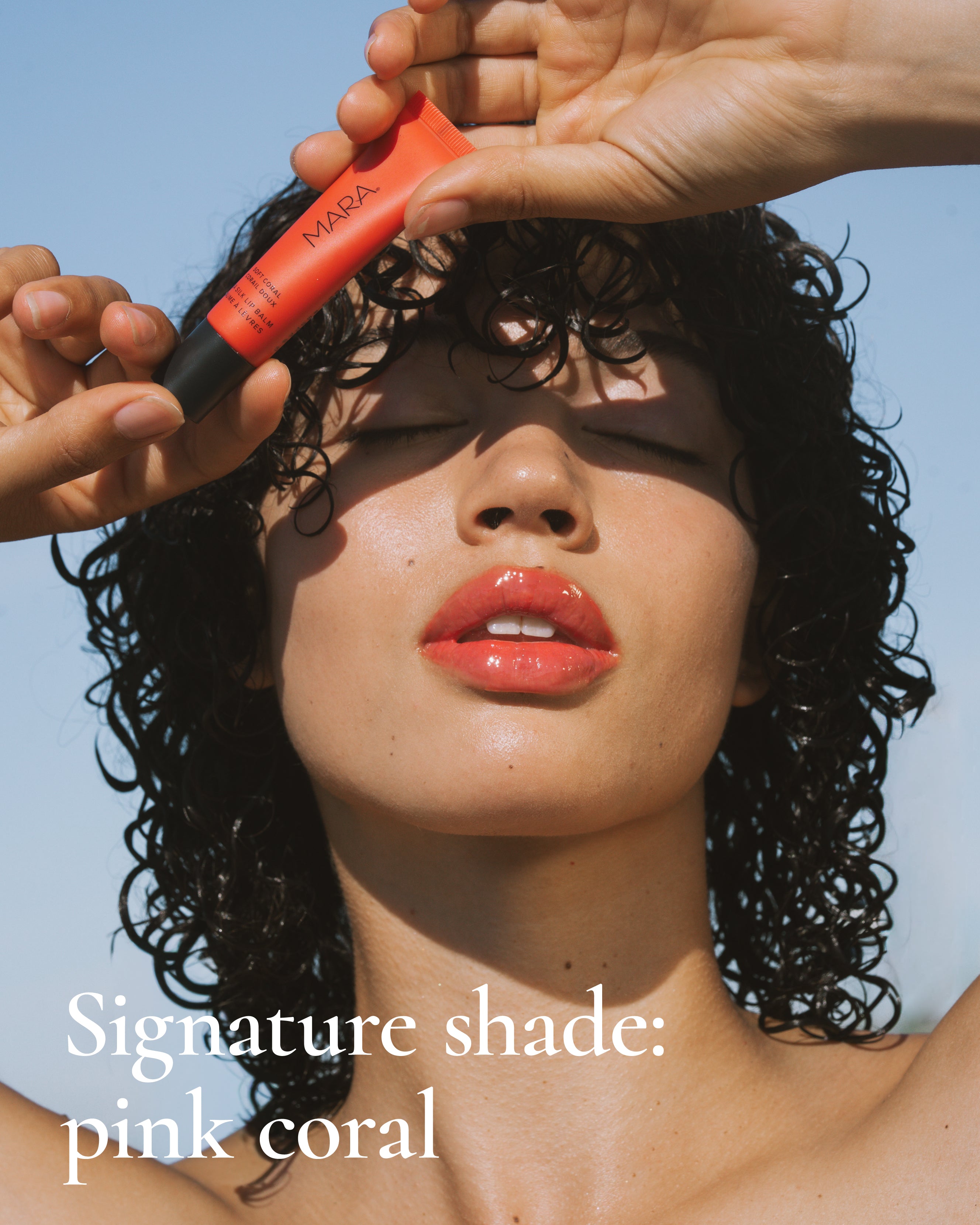 Woman holding MARA Sea Silk Lip Balm Coral 