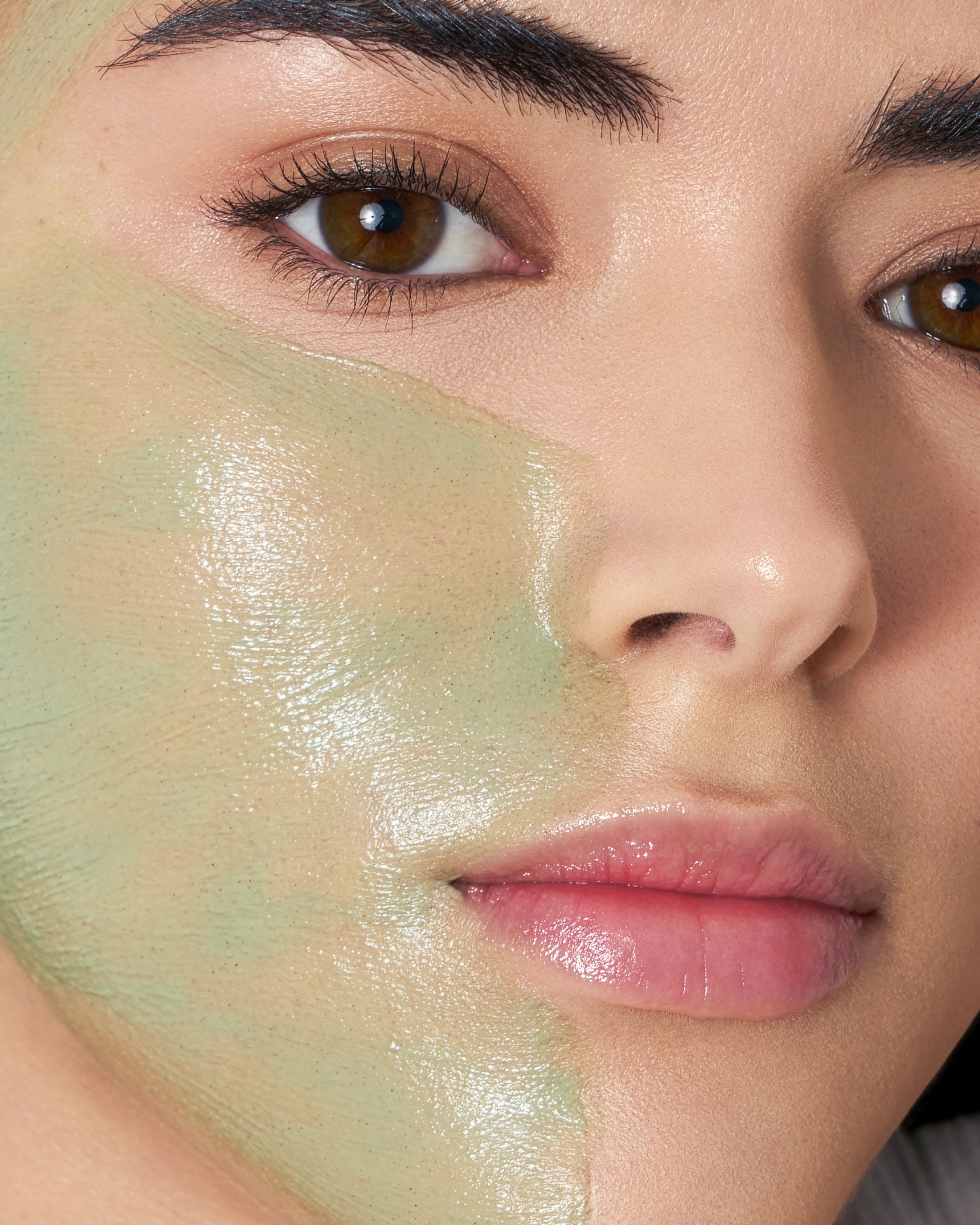 Close up of MARA Volcanic Sea Clay Detox Masque on woman's face