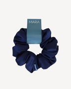 Navy blue scrunchie with a 'MARA' branded card on a white background