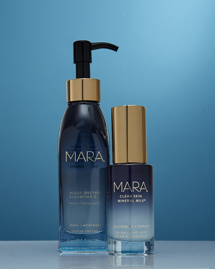 Cleansing Oil and Clear Skin Mineral Milk on a blue background