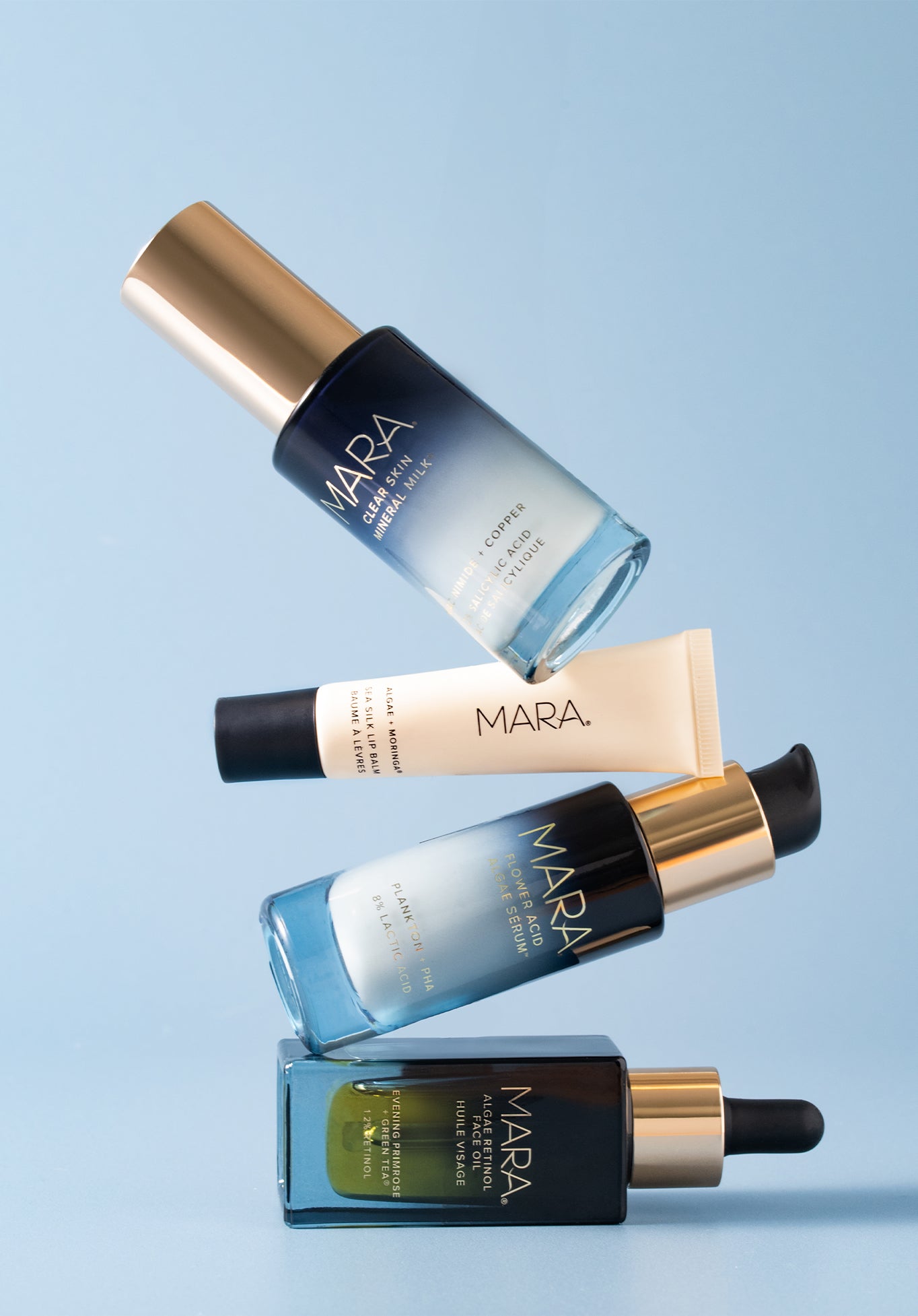 MARA Treatments and Sea Silk Lip Balm stacked on blue background