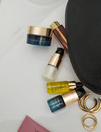Cosmetic products including MARA skincare with jars, bottles, and a pouch on a light background