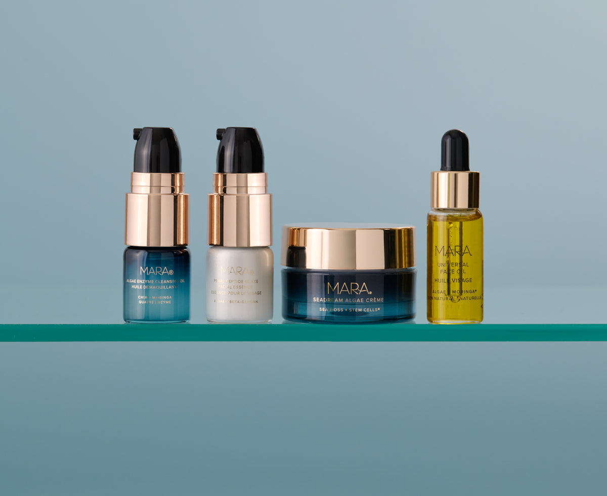 Set of MARA skincare products on a shelf with a blue background