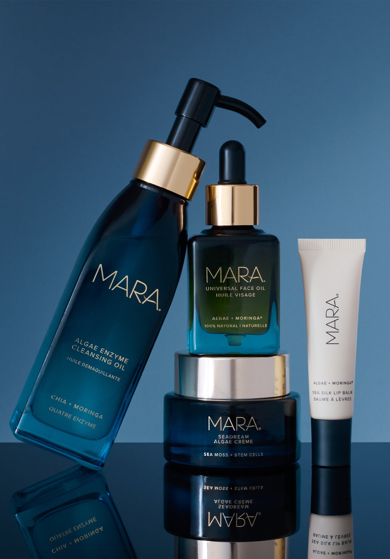 Cleansing Oil, Universal, SeaDream and lip balm on blue reflectives surface