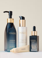 Cleansing Oil, Pearl Peptide, Lip Balm, and Vitamin C on beige background