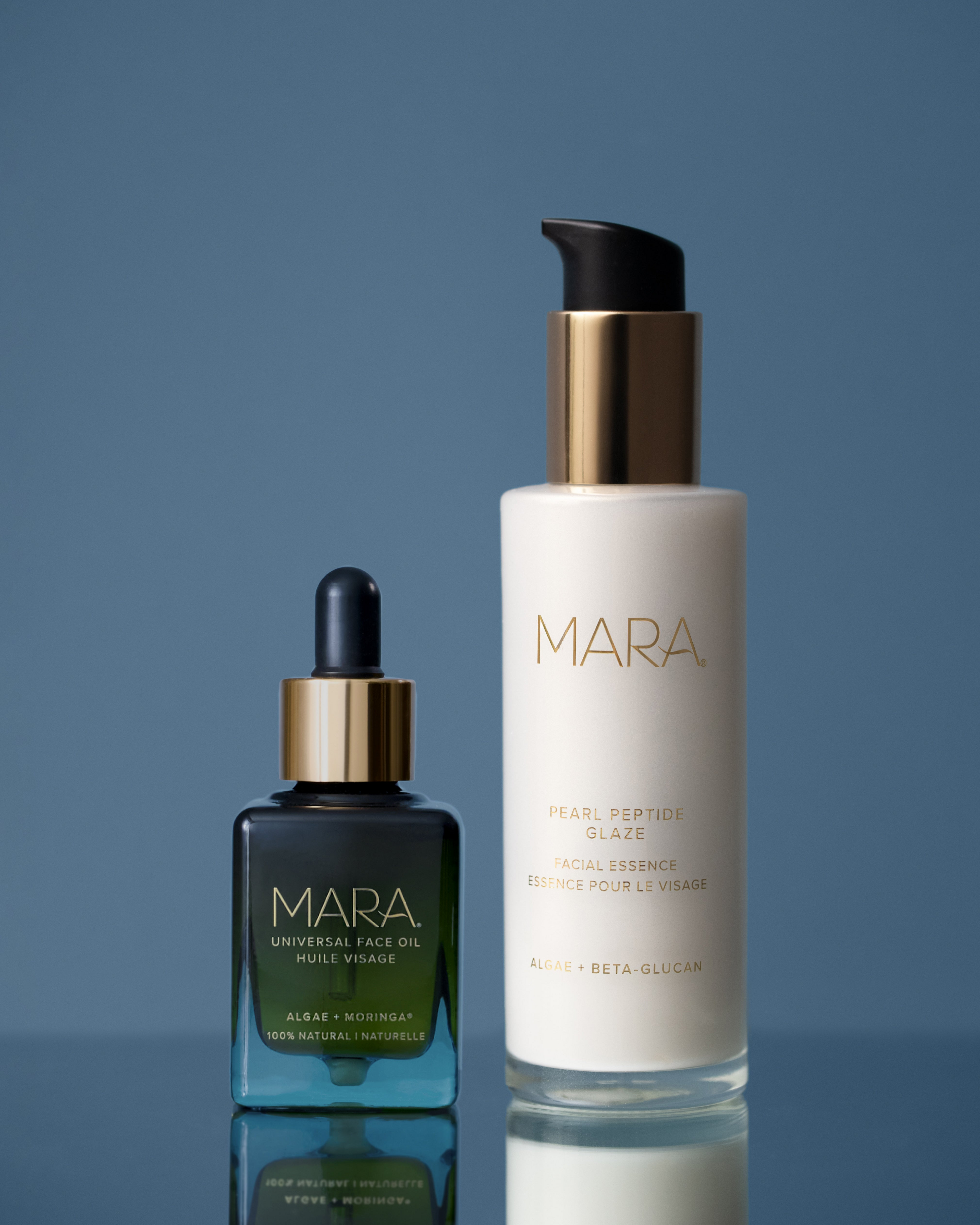 Universal Face Oil and Pearl Peptide Glaze on a reflective surface with a blue gradient background.