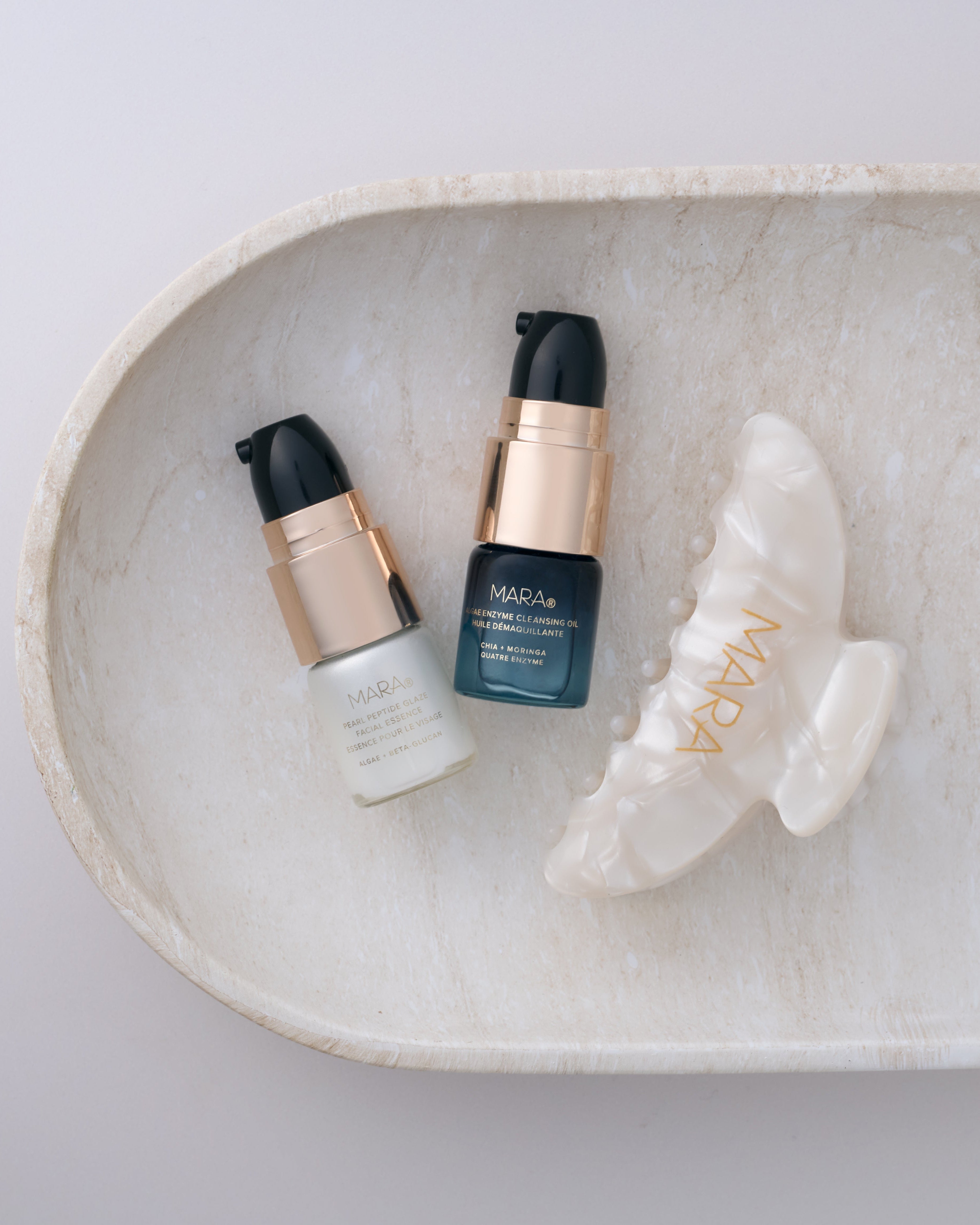 Deluxe MARA and Pearl Hair Claw on a light marble tray