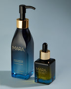 Algae Enzyme Cleansing Oil and Universal Oil on blue background