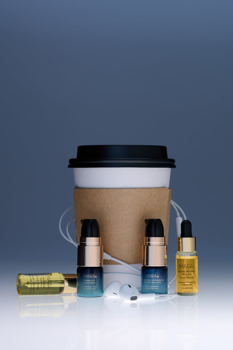 Deluxe sizes with coffee cup with earbuds wrapped arround