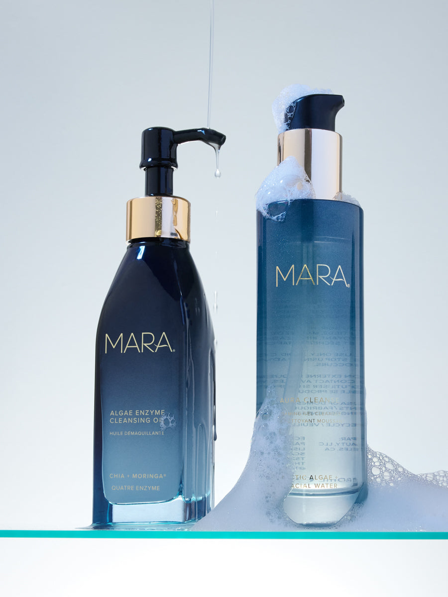 Algae Enzyme Cleansing Oil and Aura Cleanse Foaming Gel Cleanser on glass shelf