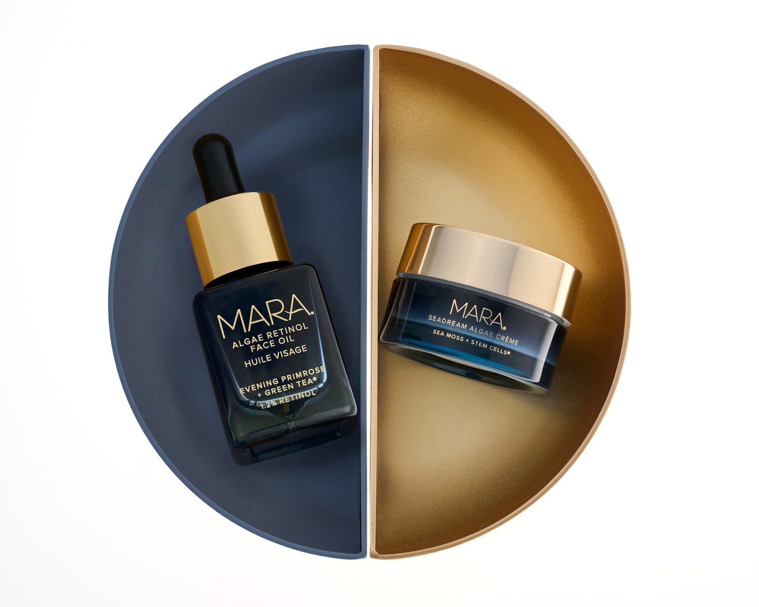 Mini Algae Retinol Face Oil and Mini SeaDream Algae Creme with blue background on a split gold and blue surface