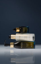 Sea Sculpt Body Oil, Pearl Peptide Glaze, Universal Face Oil stacked on dark blue background