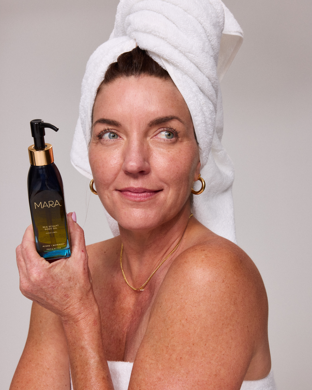 Model holding ssbo in towel 